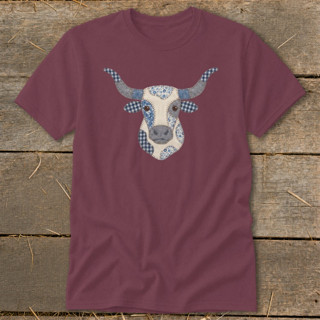 Maroon t-shirt with a patchwork longhorn cow face graphic.