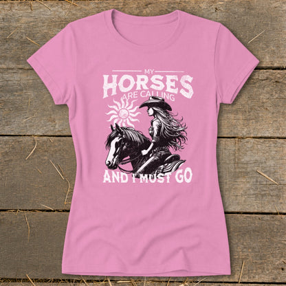 Pink t-shirt with "My Horses Are Calling And I Must Go" text and horse rider graphic.