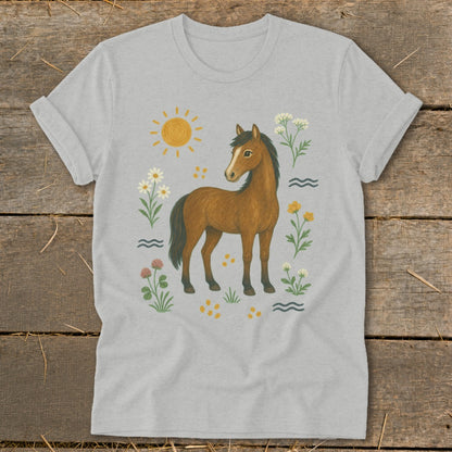 Brown horse with flowers, sun, and waves design on a light grey t-shirt.