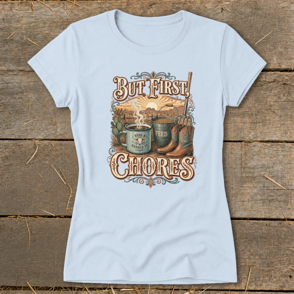 Light blue t-shirt with "But First, Chores" text, coffee mug, feed bucket, and cowboy boots.