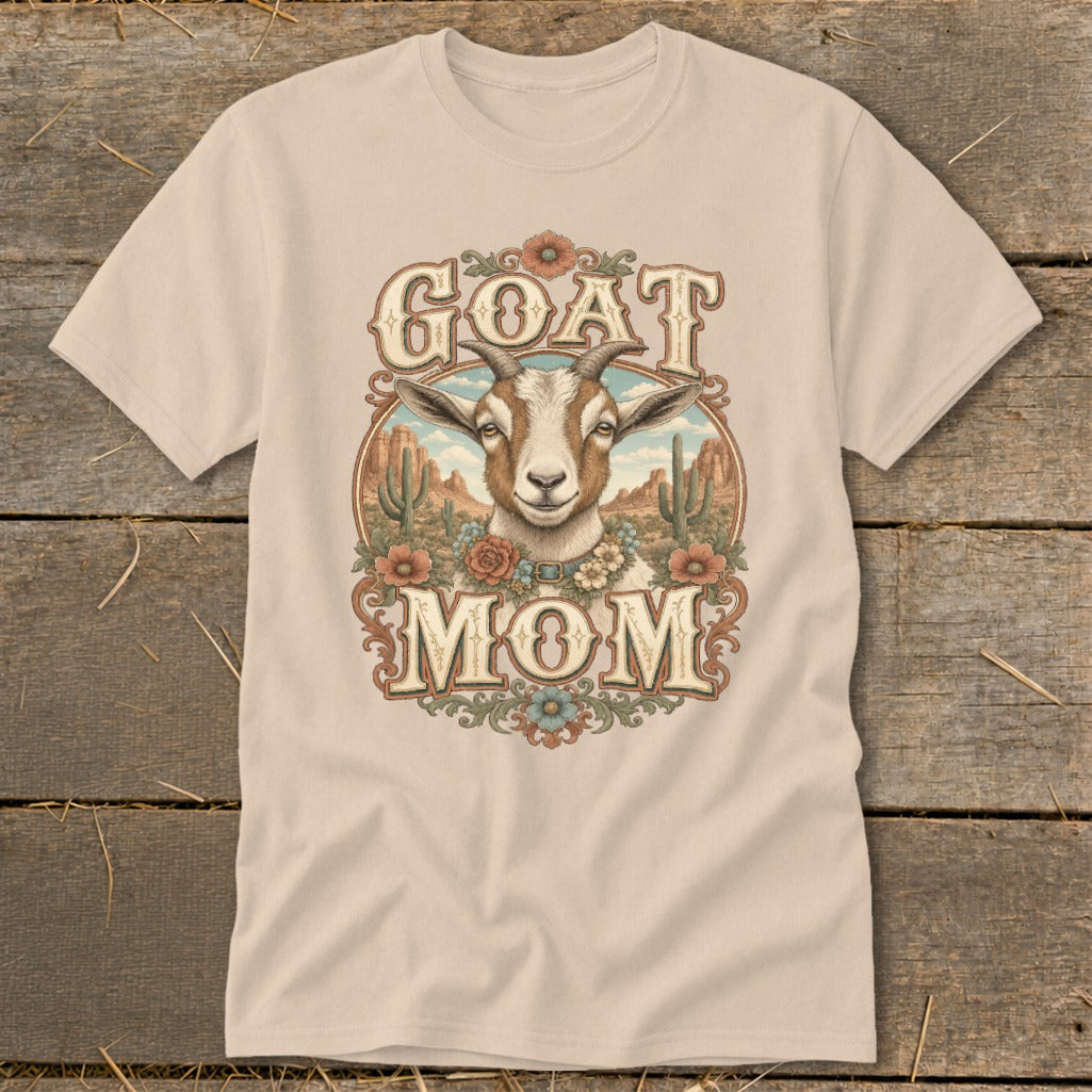 T-shirt with a goat head and "GOAT MOM" text in a desert scene.