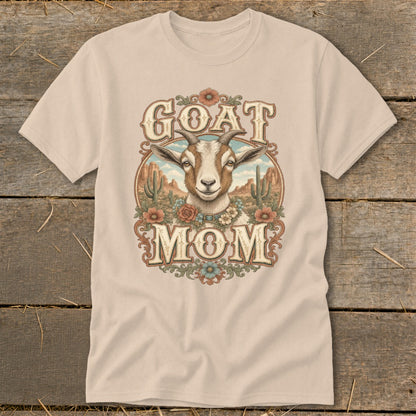 T-shirt with a goat head and "GOAT MOM" text in a desert scene.