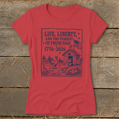 Red t-shirt with a dark blue graphic of chickens, a coop, and text about fresh eggs.