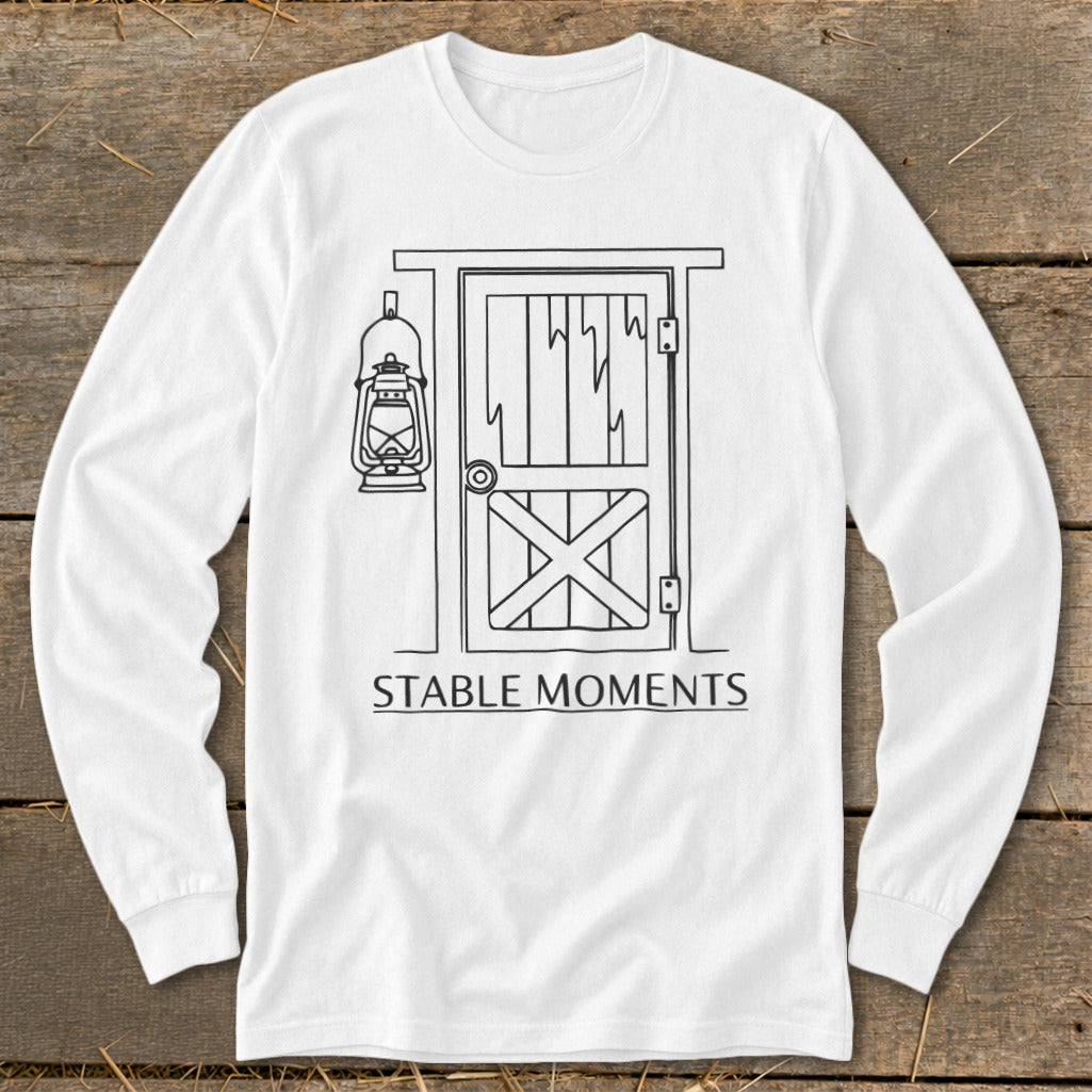 Long-sleeve white shirt with line drawing of a barn door and lantern, text Stable Moments.