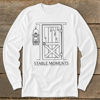 Long-sleeve white shirt with line drawing of a barn door and lantern, text Stable Moments.