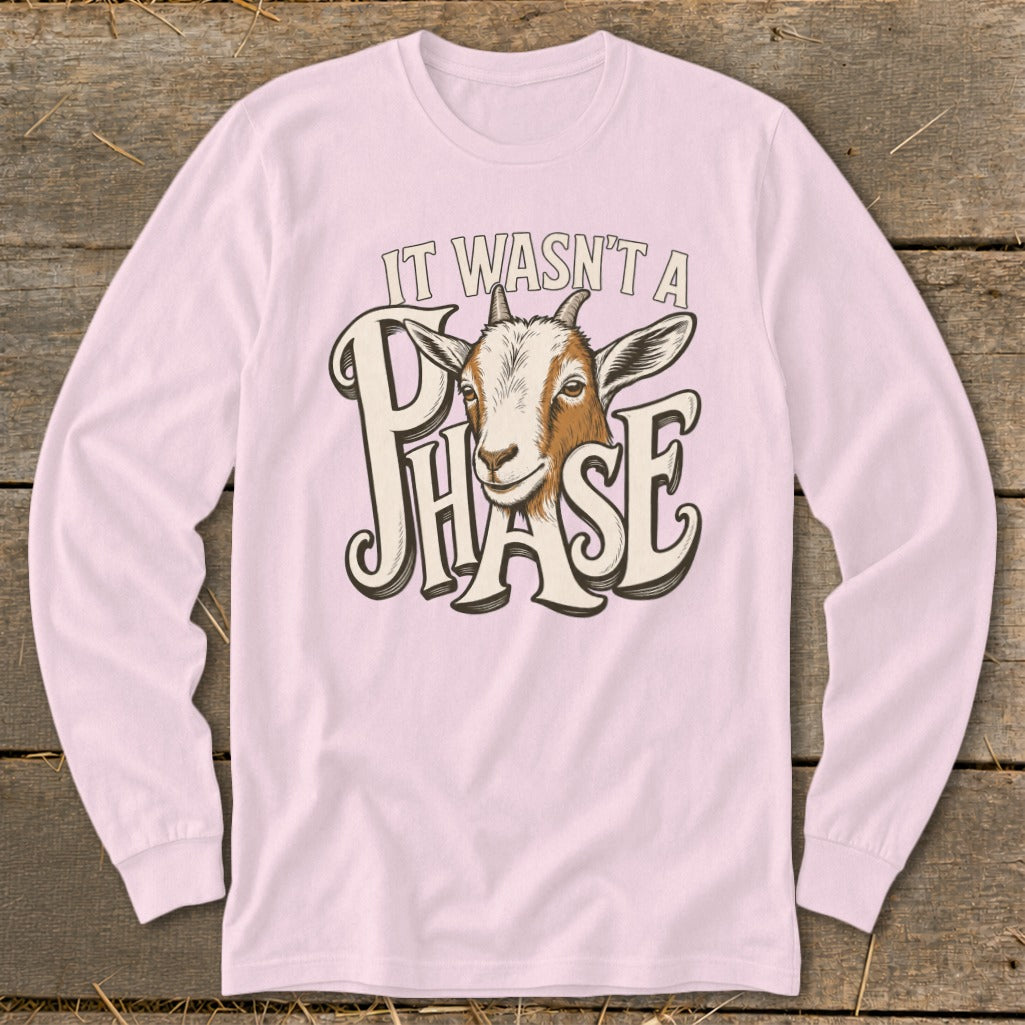 Pink long sleeve shirt with a goat illustration and text "IT WASN'T A PHASE".