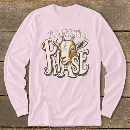 Pink long sleeve shirt with a goat illustration and text "IT WASN'T A PHASE".