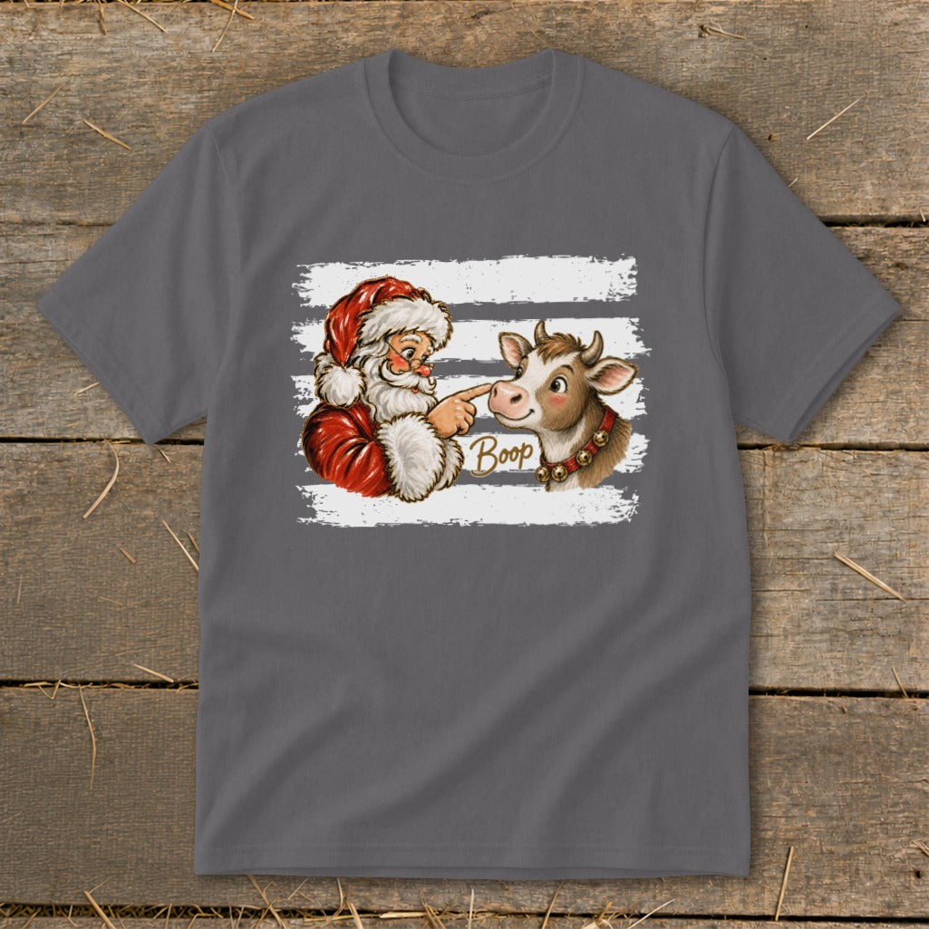 Santa touching a cow's nose with the word "Boop" on a t-shirt.