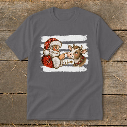 Santa touching a cow's nose with the word "Boop" on a t-shirt.
