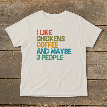 Cream t-shirt with vintage text: I Like Chickens Coffee And Maybe 3 People.