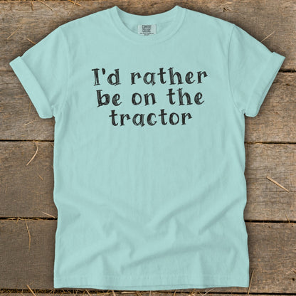 Light blue t-shirt with black text: "I'd rather be on the tractor".