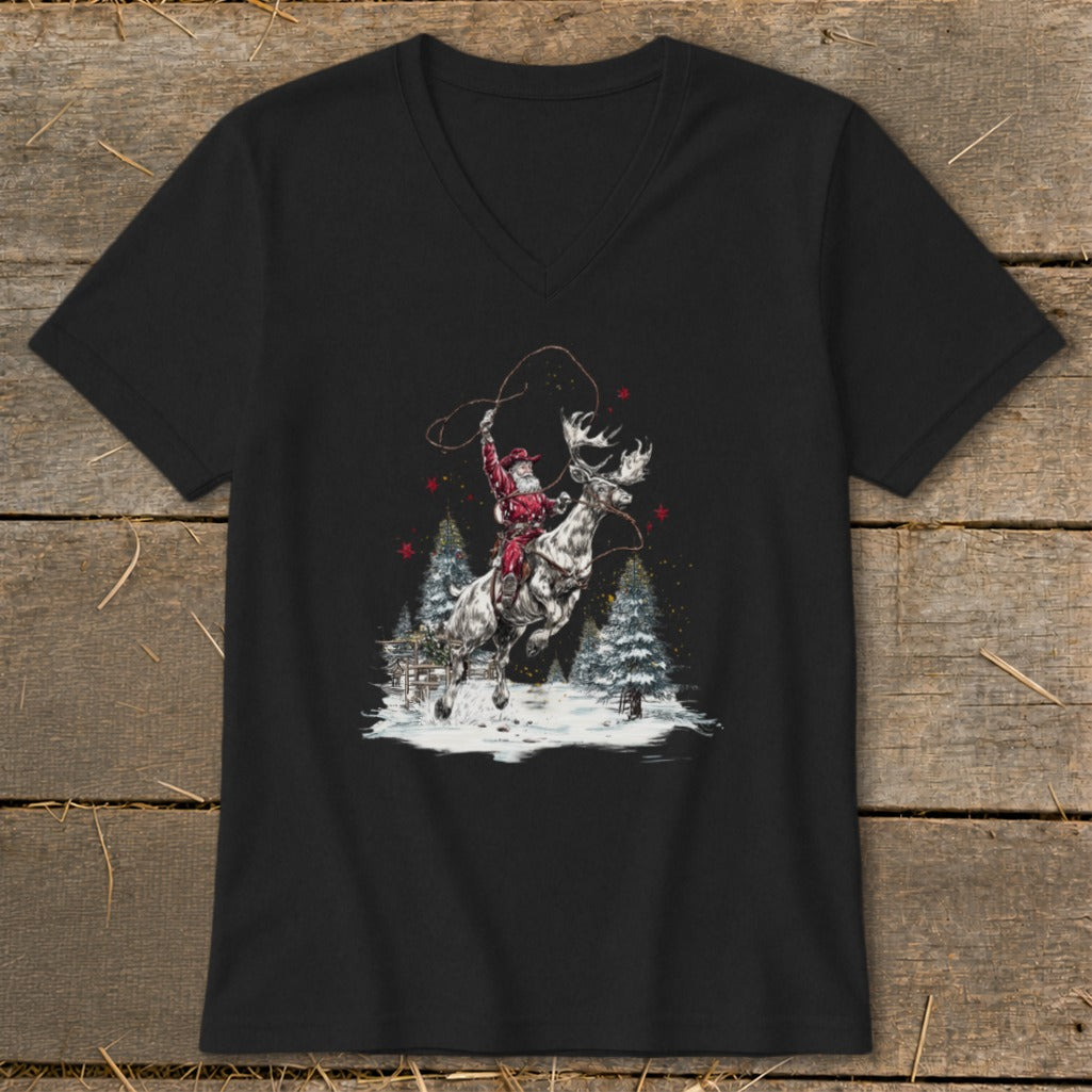 Santa Claus rides a moose while lassoing in a snowy forest scene.