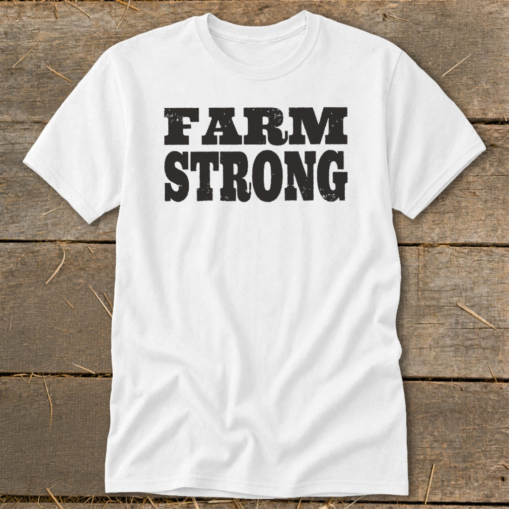 A white t-shirt featuring the distressed black text FARM STRONG displayed across the chest.