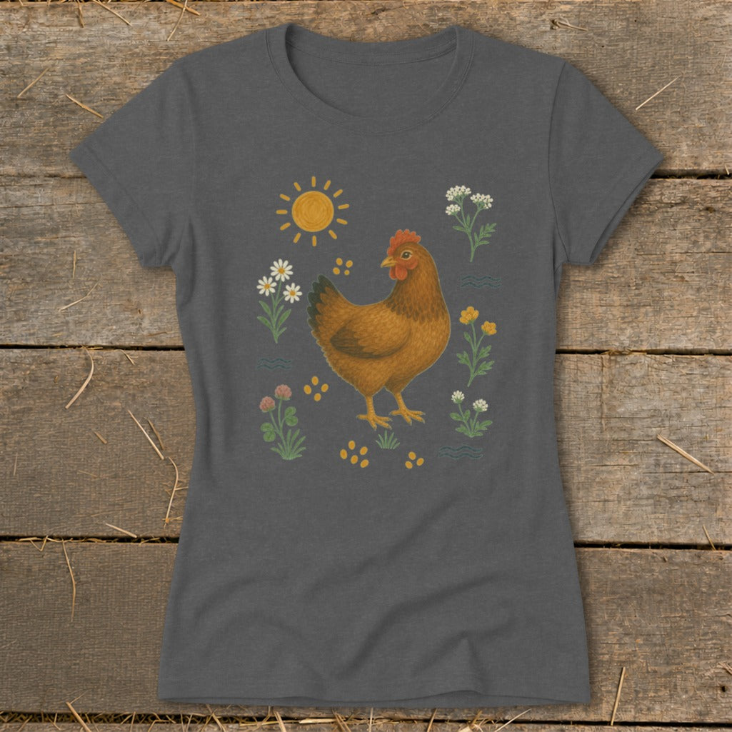 T-shirt with a brown chicken surrounded by flowers, sun, and yellow dots.