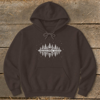 Brown hoodie with a reflected forest, deer, and snowflake graphic design.
