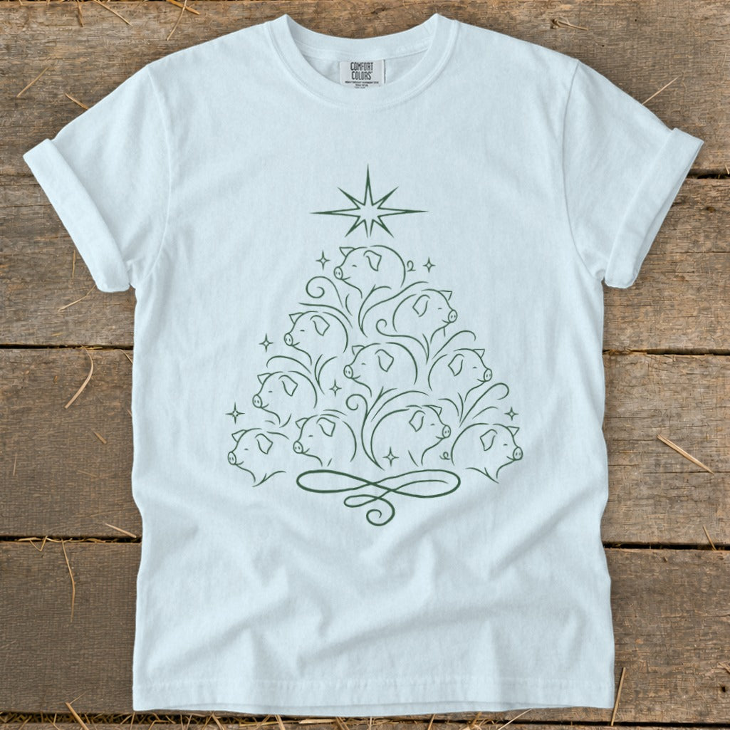 White t-shirt with a green line drawing of a Christmas tree made of pigs.
