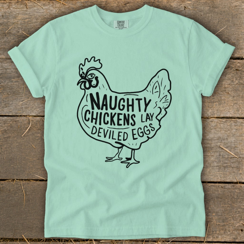 Mint green t-shirt with black graphic of a chicken and text "Naughty Chickens Lay Deviled Eggs".