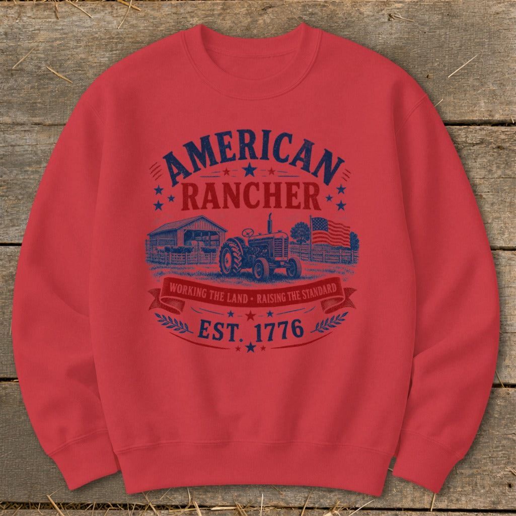 Red sweatshirt with "American Rancher Est. 1776" graphic featuring tractor and barn.