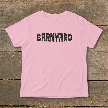 Pink short-sleeved t-shirt with the word BARNYARD printed in black block letters across the chest.