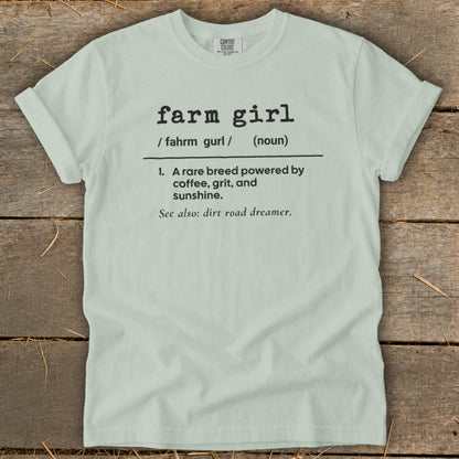 Light green t-shirt with "farm girl" definition: powered by coffee, grit, and sunshine.