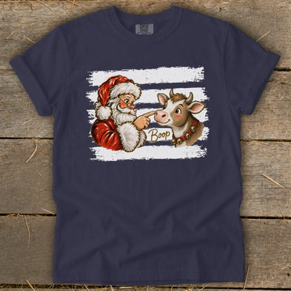 Santa booping a cow with the word "Boop" on a navy blue shirt.