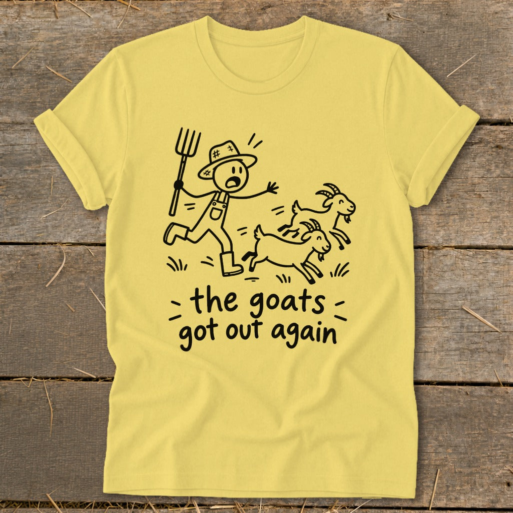 Yellow t-shirt with a stick figure farmer chasing escaped goats, text reads "the goats got out again".