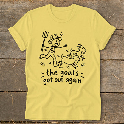 Yellow t-shirt with a stick figure farmer chasing escaped goats, text reads "the goats got out again".