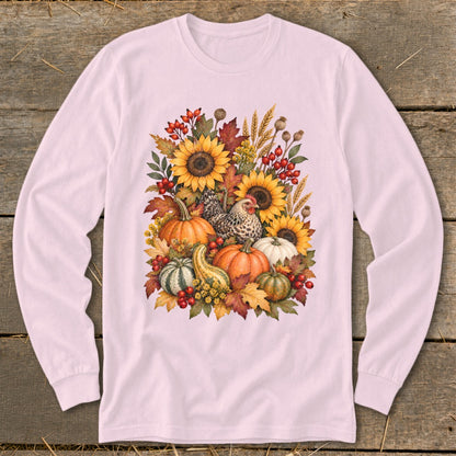 Pink long-sleeve shirt with a watercolor fall harvest design featuring pumpkins, sunflowers, and a chicken.