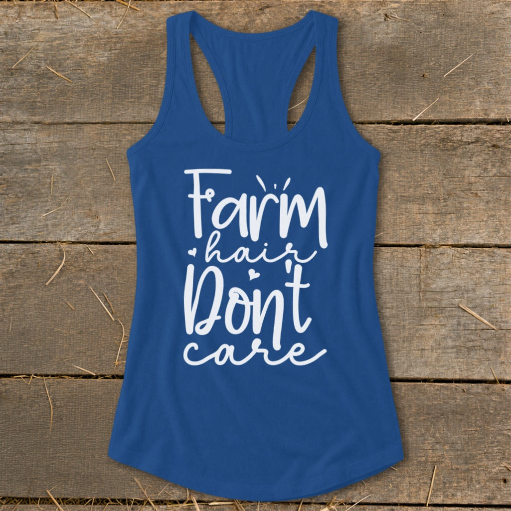 Blue tank top with white text reading "Farm hair don't care".
