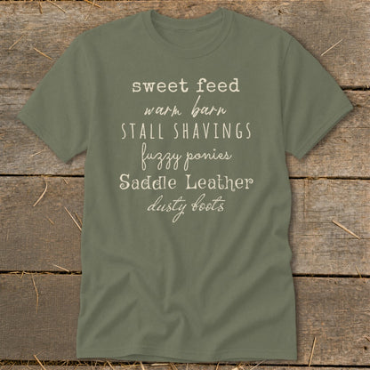 Olive green t-shirt with list of phrases in white script font.