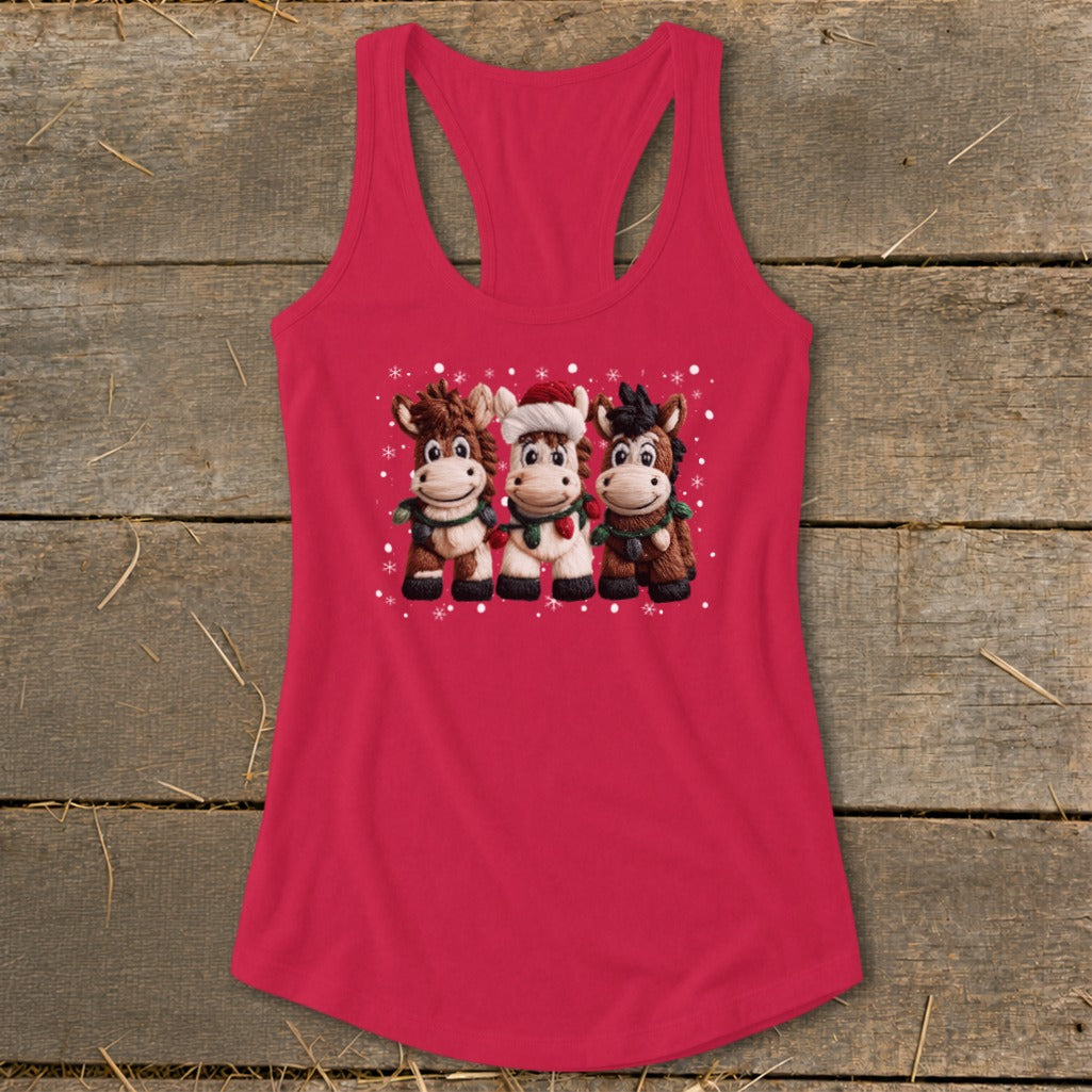 Three cartoon horses wearing scarves and one in a Santa hat, with snowflakes.
