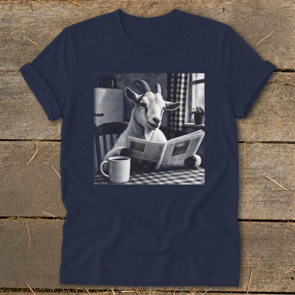Dark blue t-shirt featuring a black and white graphic of a goat reading a newspaper at a table with a coffee mug.