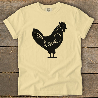 Light yellow t-shirt with a black silhouette of a rooster with the word "love" on it.