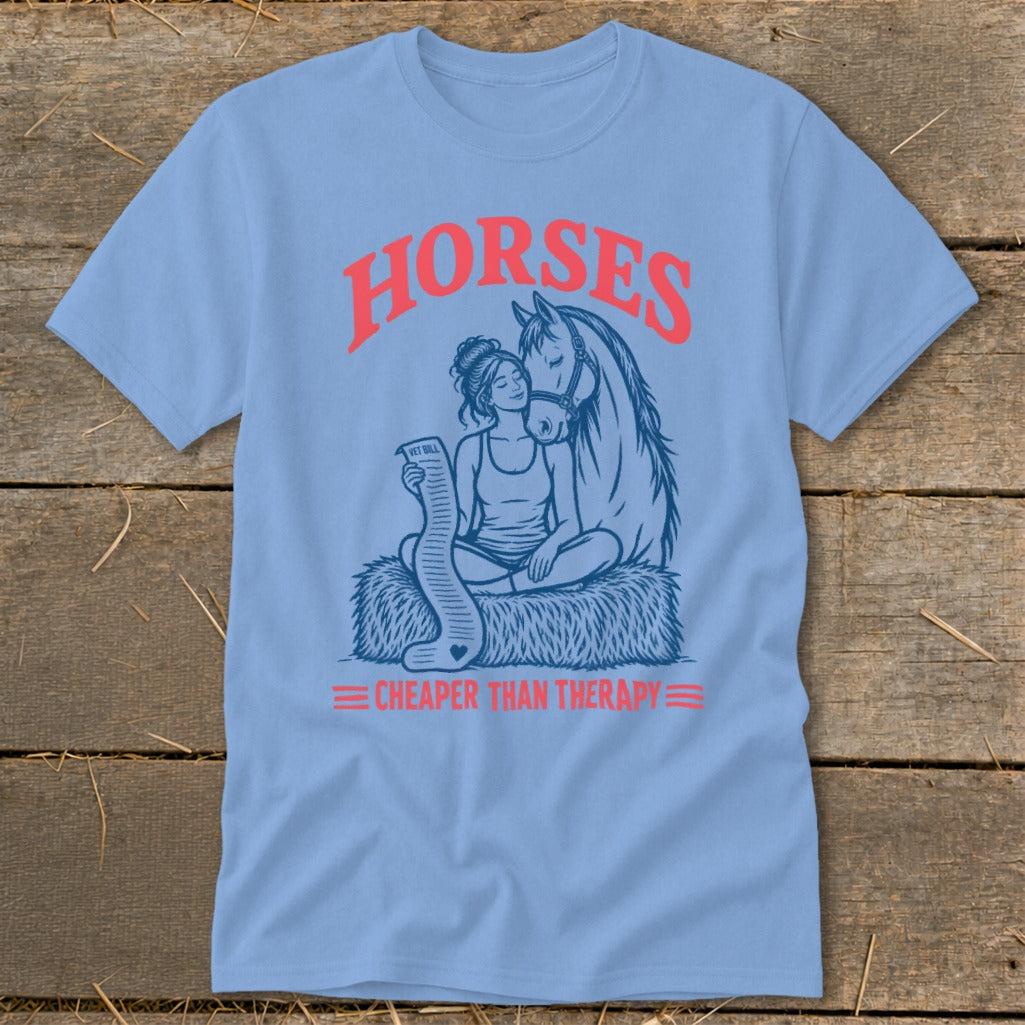 Blue t-shirt graphic: woman with horse and vet bill, "Horses Cheaper Than Therapy"