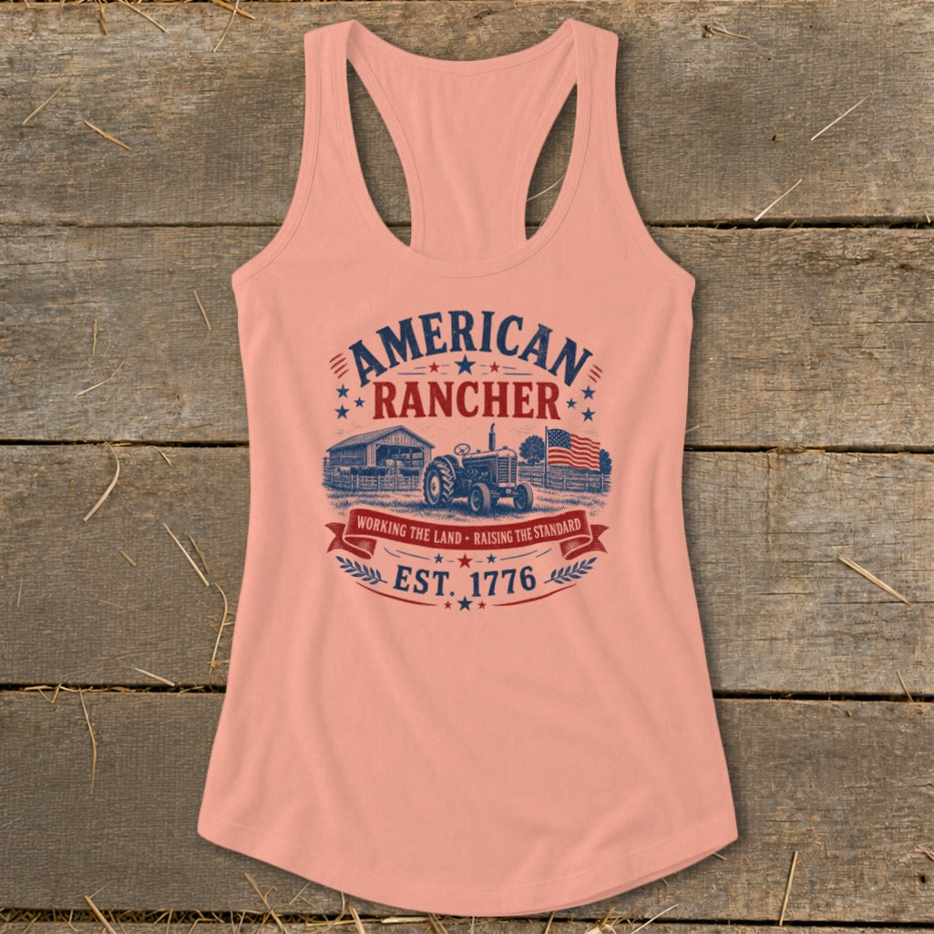 Peach tank top with "American Rancher Est. 1776" graphic and tractor scene.