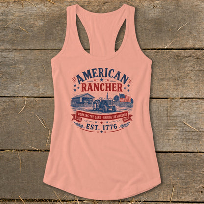 Peach tank top with "American Rancher Est. 1776" graphic and tractor scene.
