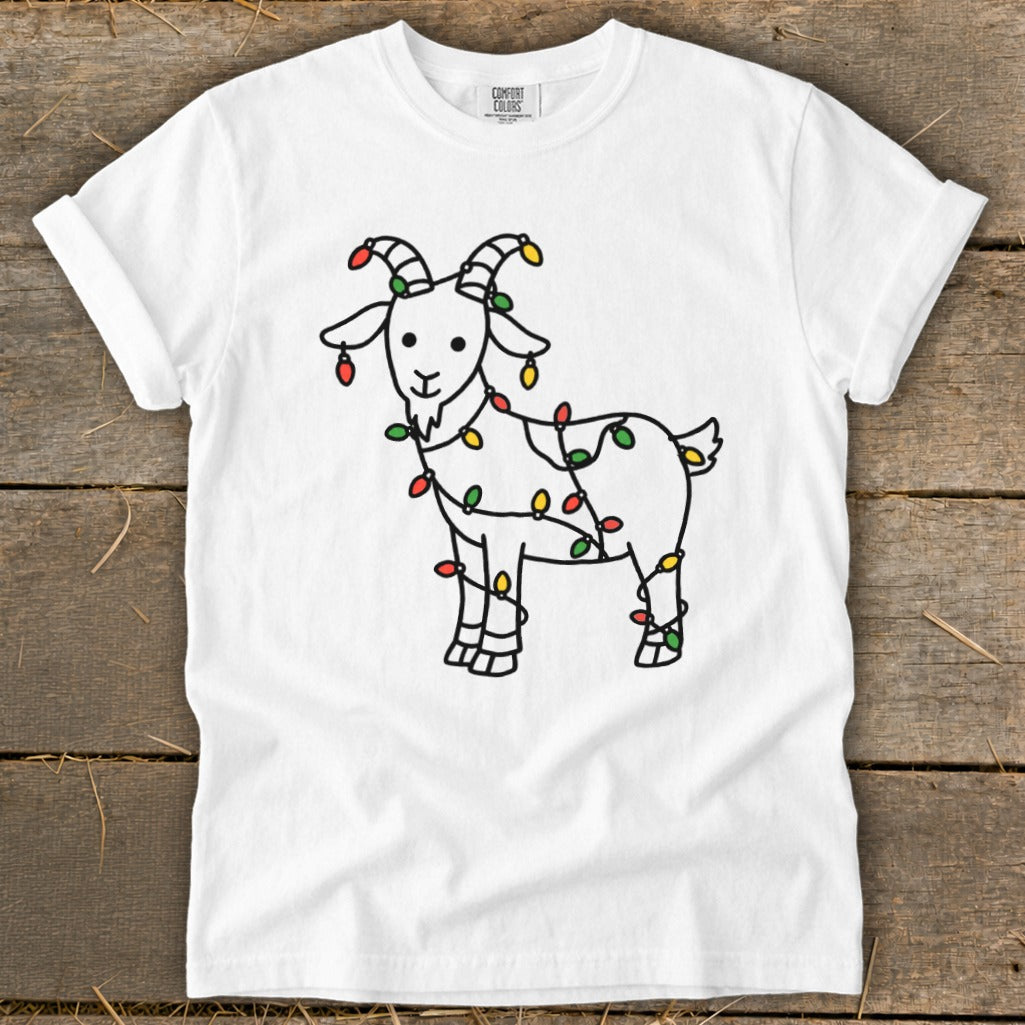 White t-shirt with a black outline drawing of a goat wrapped in colorful Christmas lights.