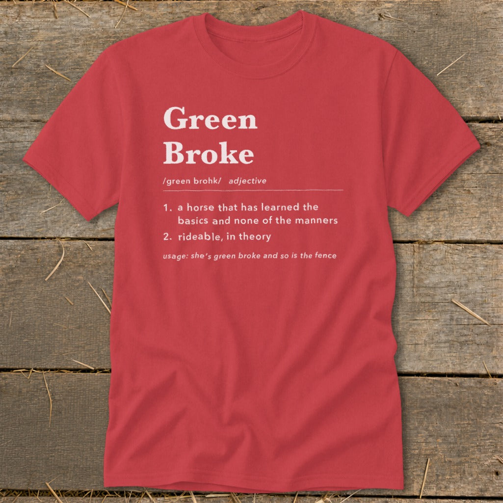 A red crewneck t-shirt featuring a humorous dictionary definition of Green Broke printed in white.