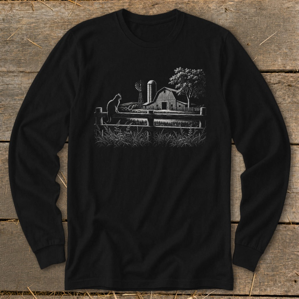 Black long sleeve shirt with a white sketch of a barn, windmill, cat, and fence.