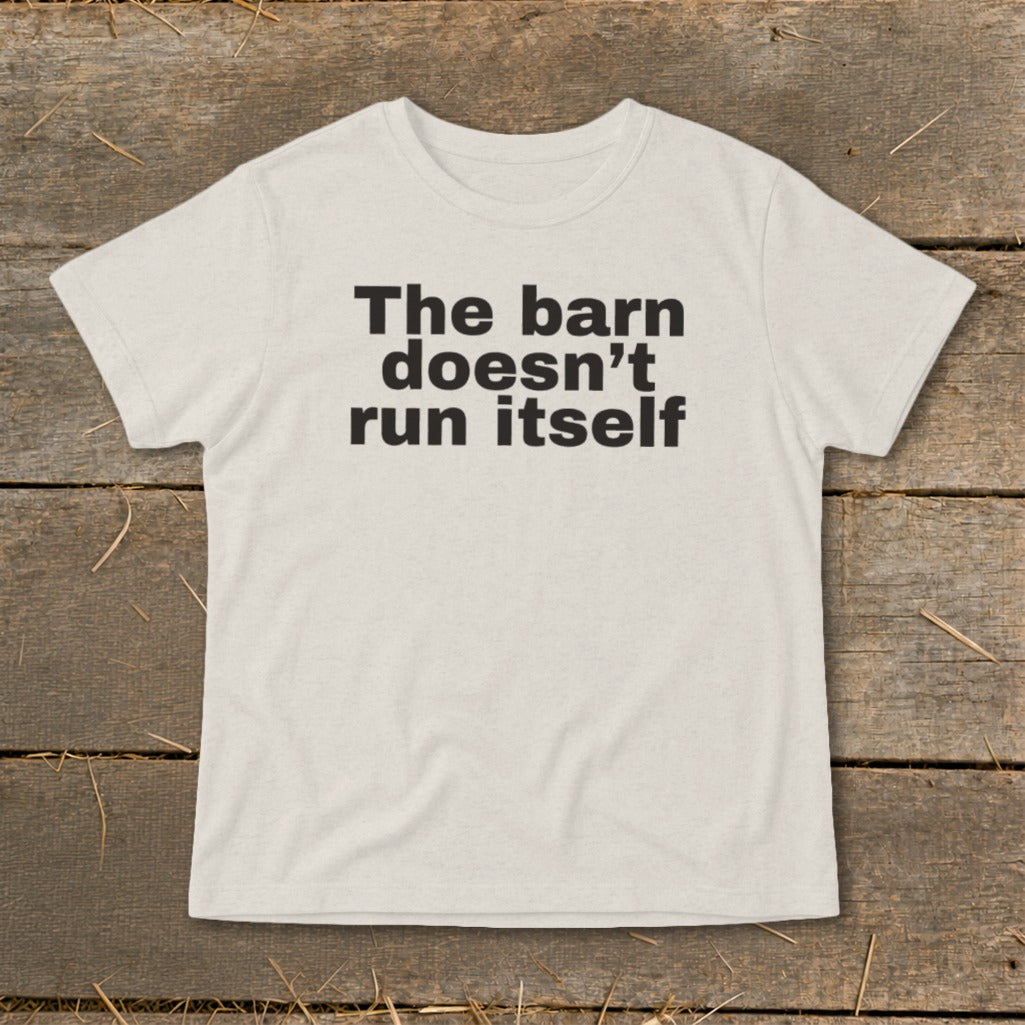 Light cream t-shirt with black text reading "The barn doesn't run itself."