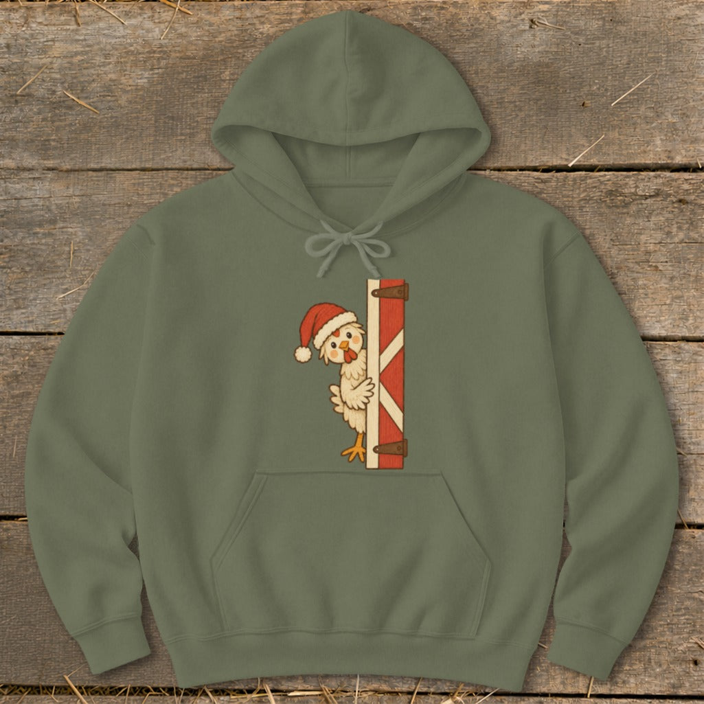 Green hoodie with a cartoon chicken wearing a Santa hat peeking behind a barn door.