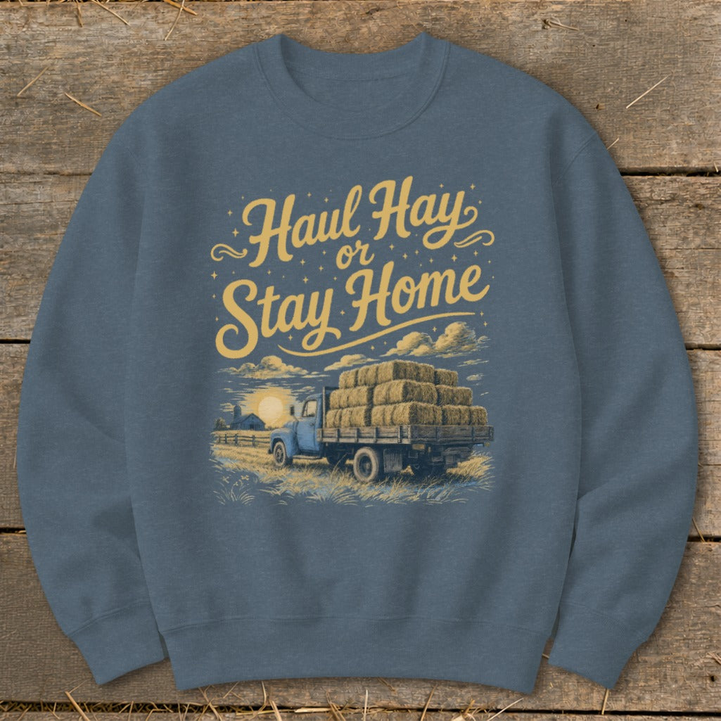 Blue sweatshirt with "Haul Hay or Stay Home" text and a truck loaded with hay bales.