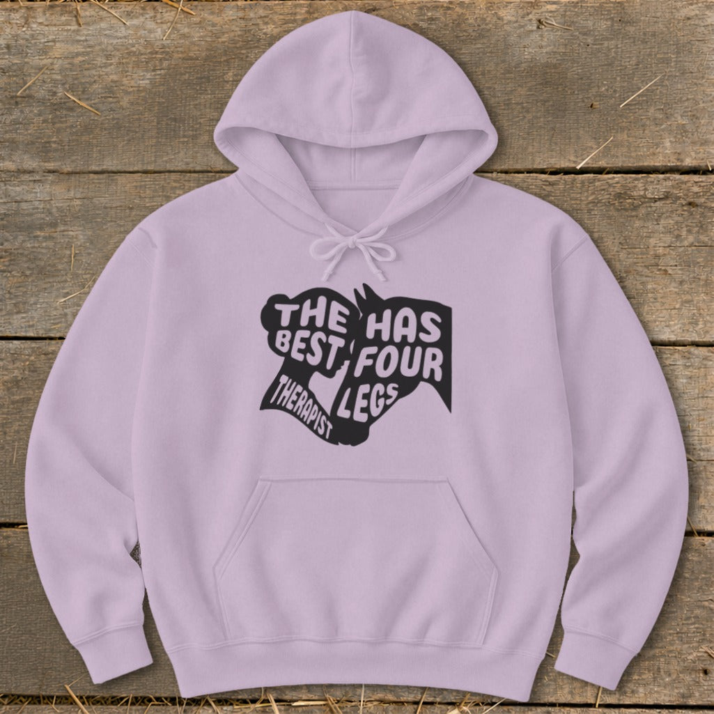 Lilac hoodie with black text and silhouette: "The best therapist has four legs."