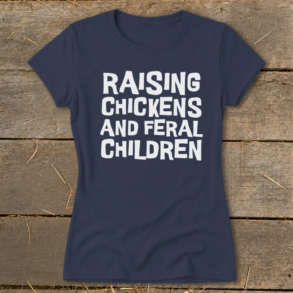 Navy t-shirt with white text "RAISING CHICKENS AND FERAL CHILDREN".