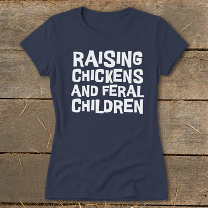Navy t-shirt with white text "RAISING CHICKENS AND FERAL CHILDREN".
