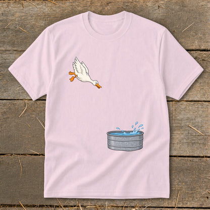 Pink t-shirt with cartoon duck jumping into a galvanized tub of water.