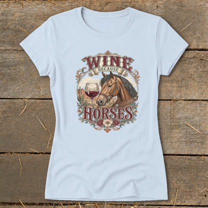 Light blue t-shirt with "Wine Because Horses" graphic featuring a horse, wine glass, and desert scene.
