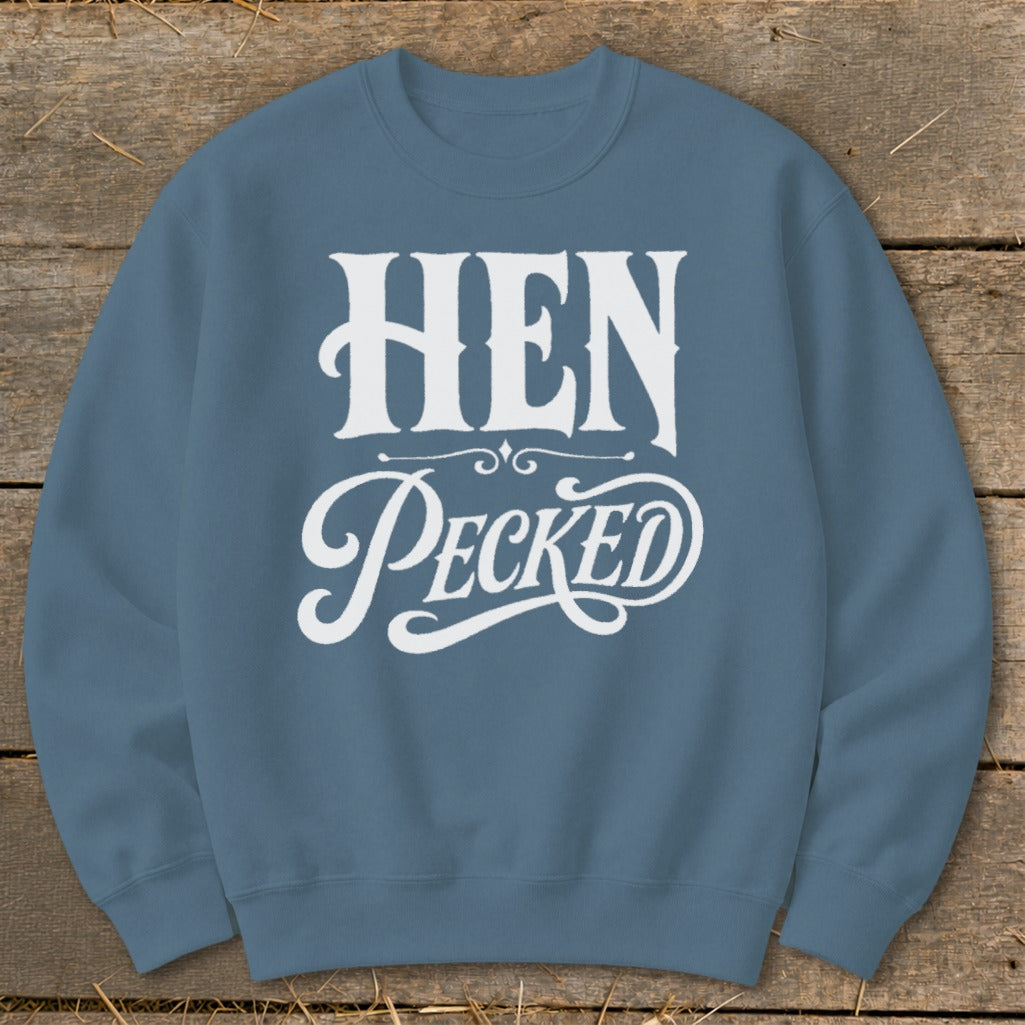 Blue sweatshirt with white text reading "HEN PECKED" in decorative font.