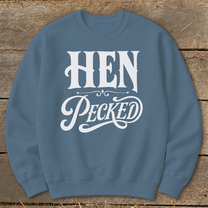Blue sweatshirt with white text reading "HEN PECKED" in decorative font.