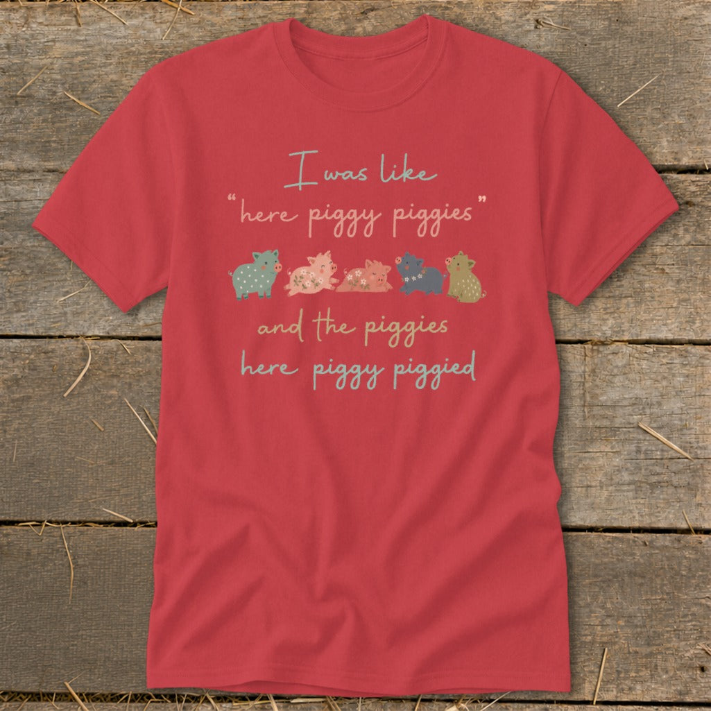 Red t-shirt with "I was like 'here piggy piggies' and the piggies here piggy piggied" and five cartoon pigs.